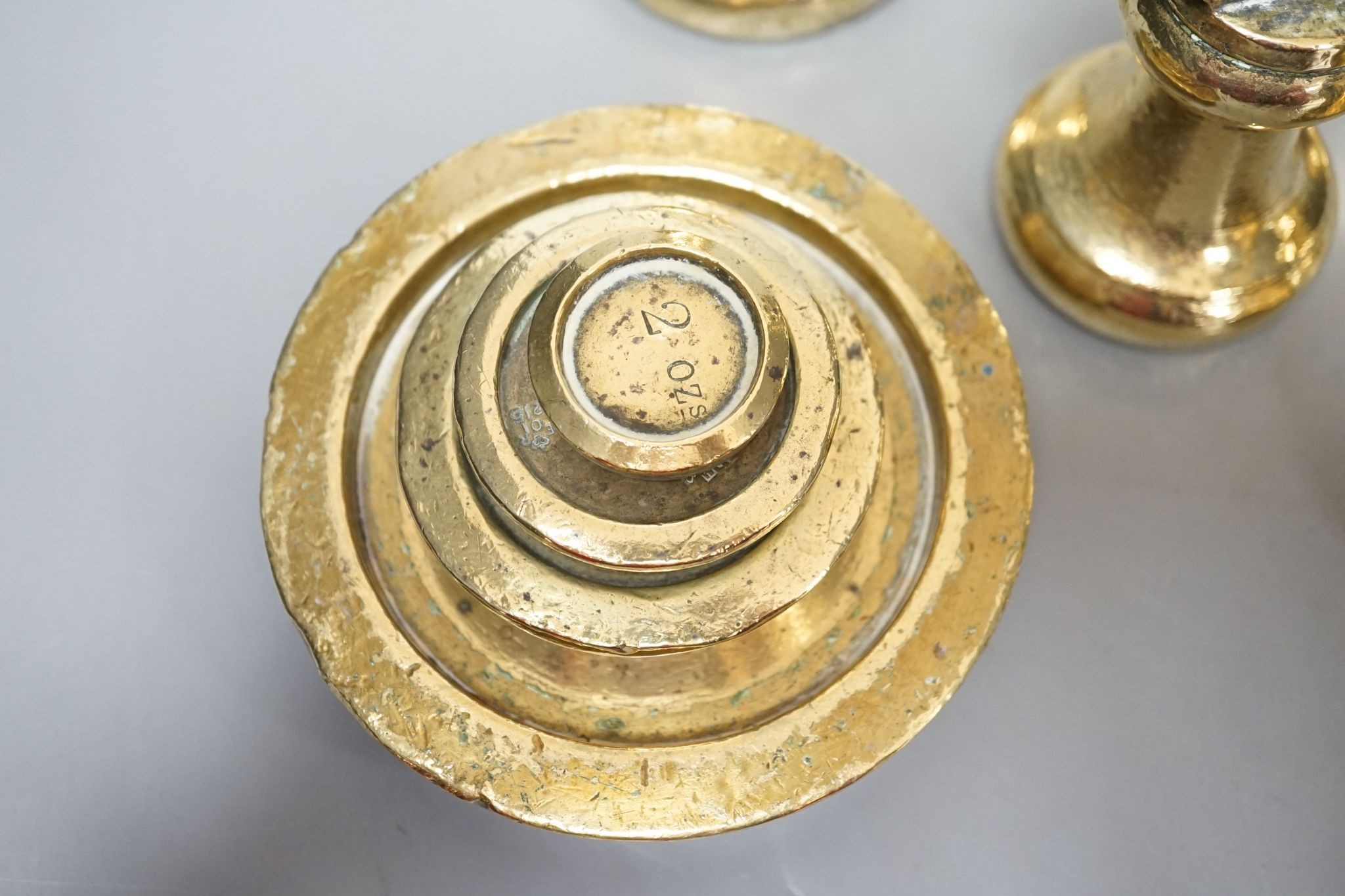 A set of 5 Victorian graduated cast brass bell weights and 3 graduated cast brass disc weights (8) 18cm